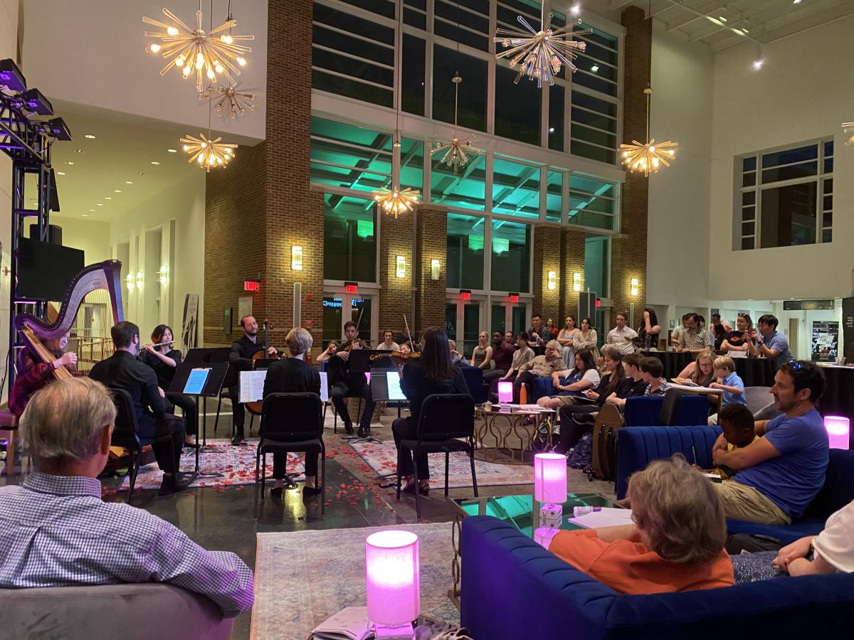 Small orchestra playing in lobby of building
