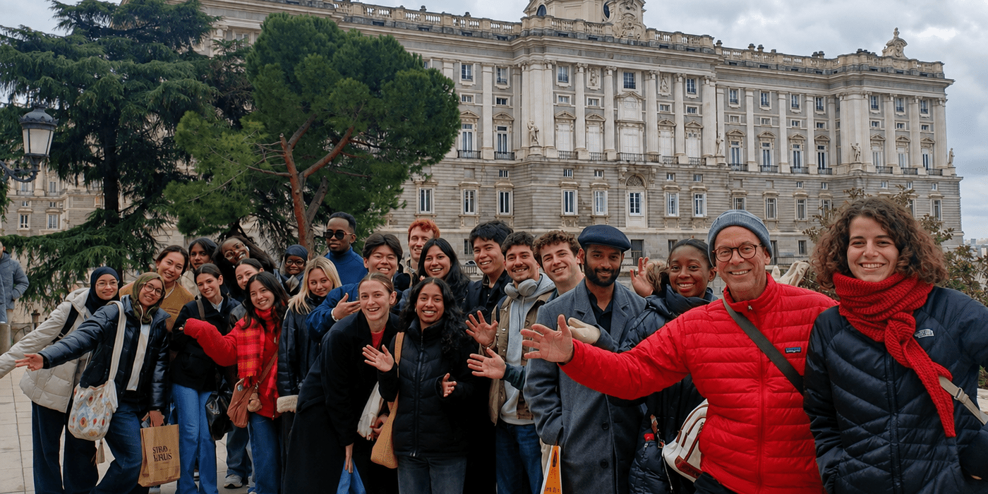 BMGT469E students and instructors gather in front of a historic palace in Spain during a study abroad course focused on innovation, design, and cross-cultural learning.